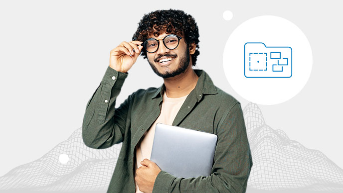 A smiling person wearing glasses and a green collared shirt with their arms crossed overlaid on a wireframe of a mountain range