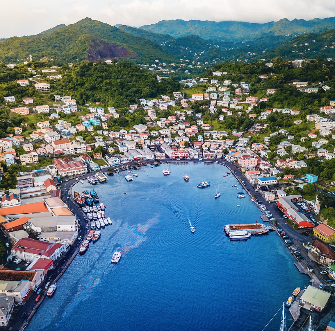 Buildings along the sea and into the hills of Grenada and Model that shows how flooding would impact buildings in Grenada. 