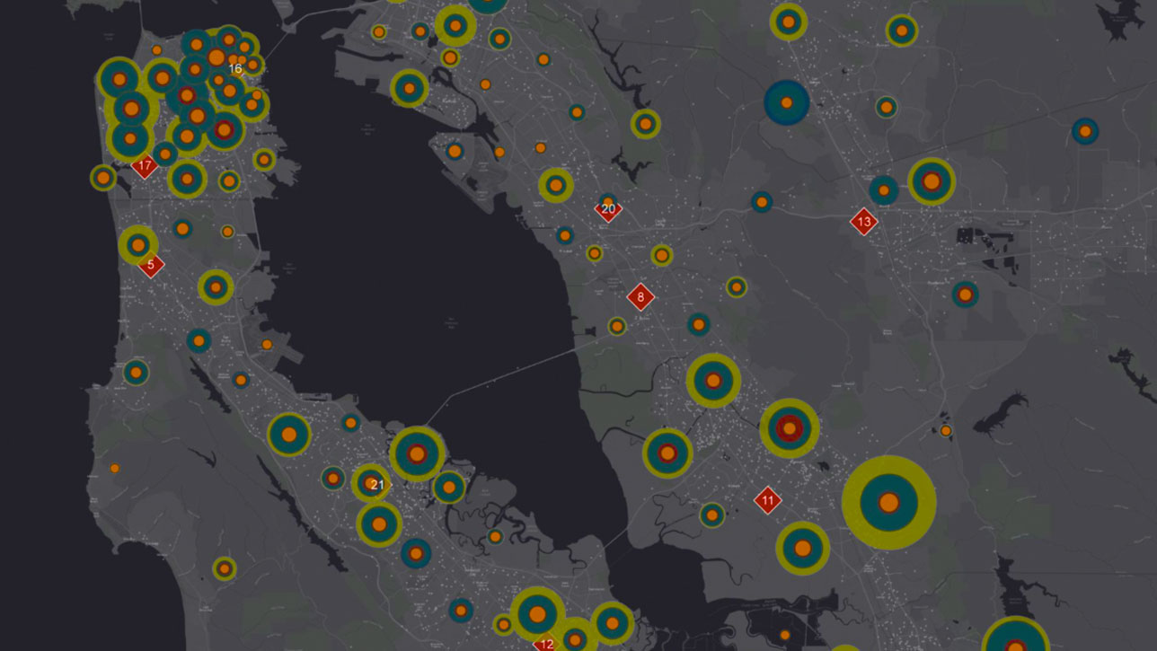 Gray map with various sizes of green and orange circles showing the number of customers that responded to marketing channels 