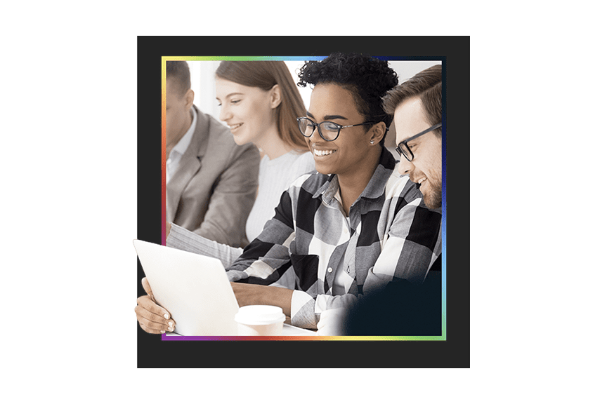 Office workers using laptops to access learning resources and build their skills